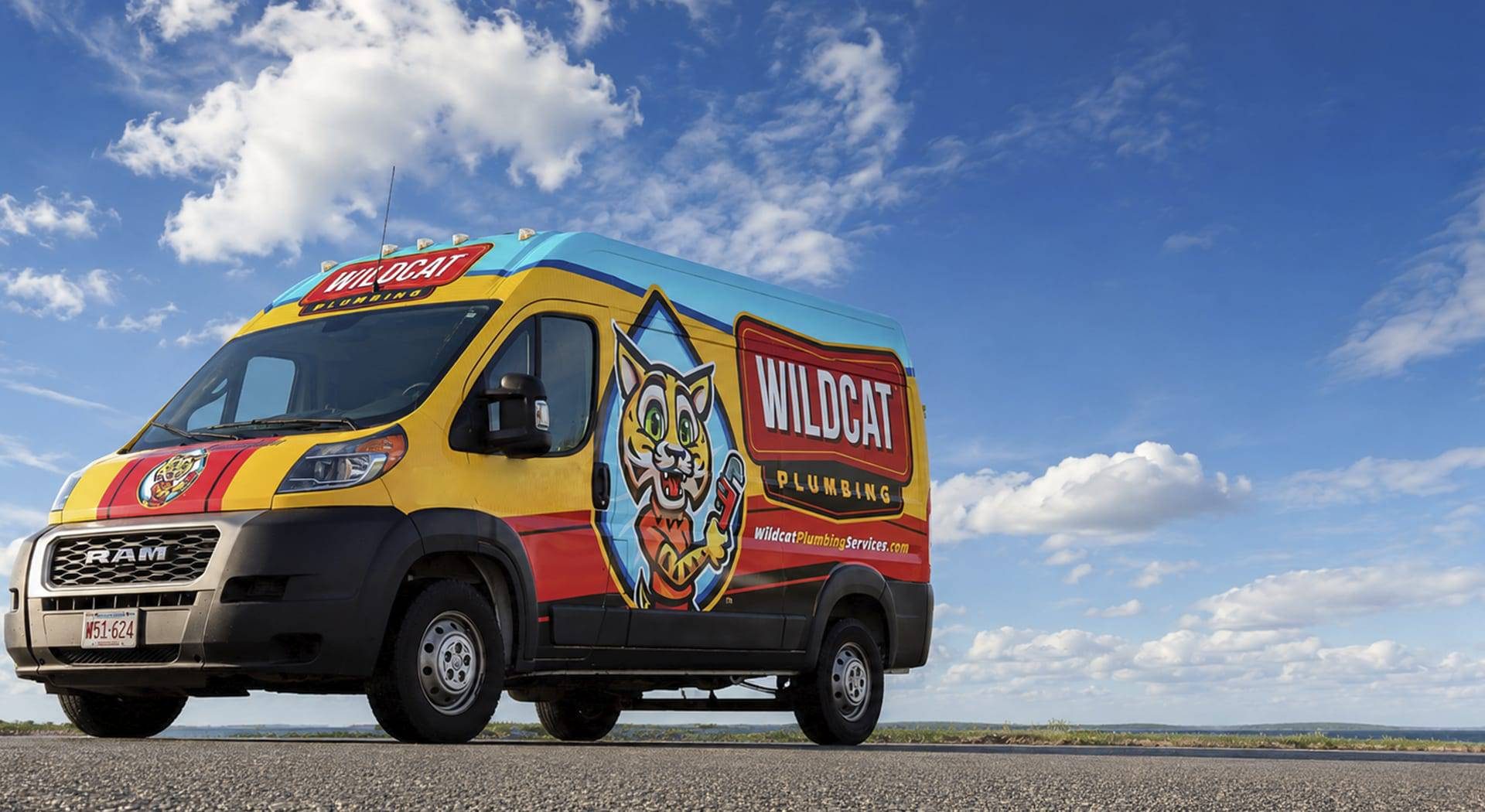 Wildcat Plumbing service van on a South Shore road